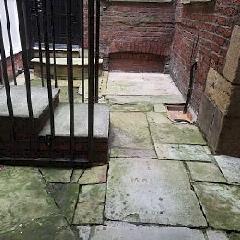 A before picture of a small patio.