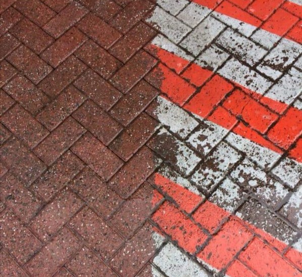 a white paint spill on block paving and a picture of it removed