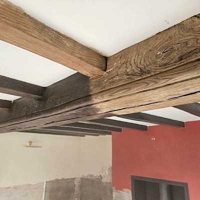 Paint being removed from a car chassis using the soda blasting method