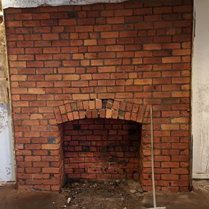 After sandblasting brick fireplace.